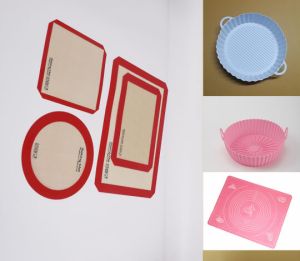 Reusable silicone baking mat with fresh baked cookies on a tray